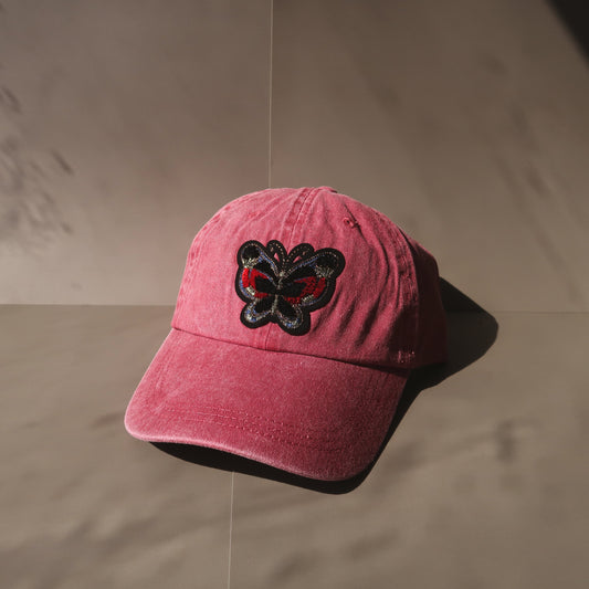 The Butterfly Baseball Cap is an essential washed cotton-twill baseball cap in vintage red. The perfect hat to elevate any casual look, whether running for coffee or any everyday adventure. #baseballcapforwomen #butterflybaseballcap #redbaseballcap #womenbaseballcap #womenhat #butterflyhat
